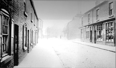 Farnworth Street or Church Street c1910. The second shop on the right hand side was owned by the Breadon Family. The shop by the lamp became the Post Office before it was moved to the corner of Derby