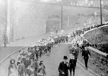 St Bedes Sunday School Procession walking down Deacon Road by Appleton Quarry Wall.